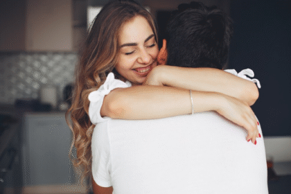why do girls hug guys over the shoulders